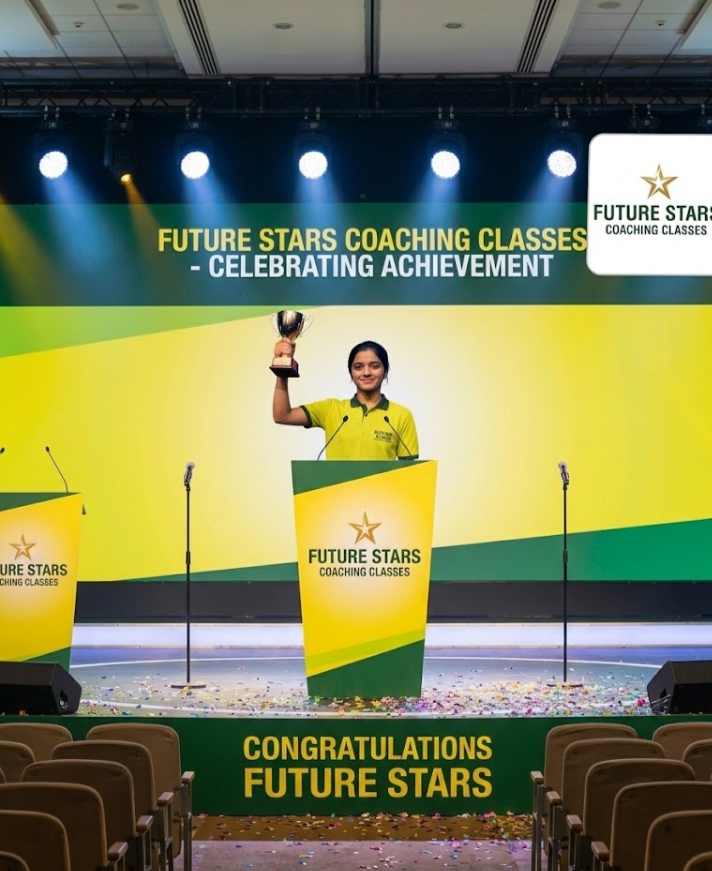 Student receives a trophy on stage