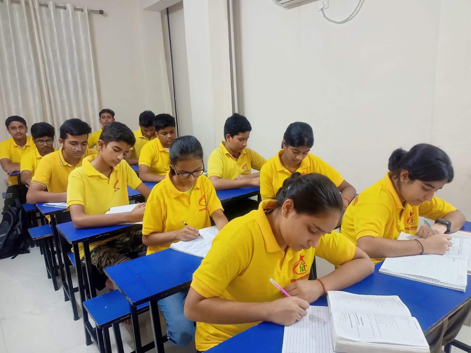 Students focused on writing in a classroom