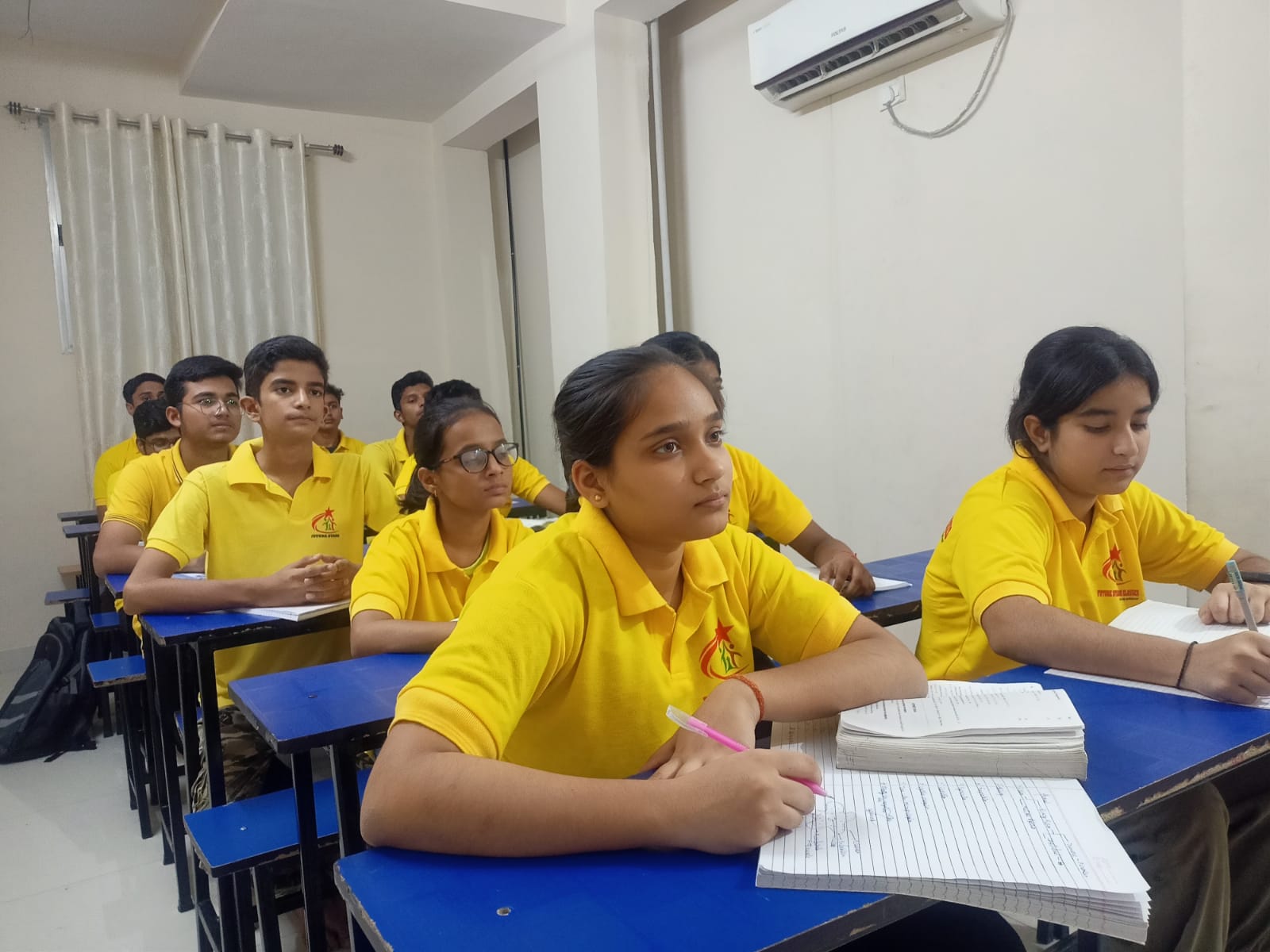 Students listening and learning in class